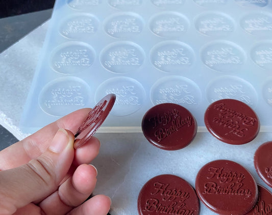 Create custom chocolates with this 24-cavity silicone mold. Food-grade, non-stick, and perfect for name toppers, cupcake designs & baking branding.